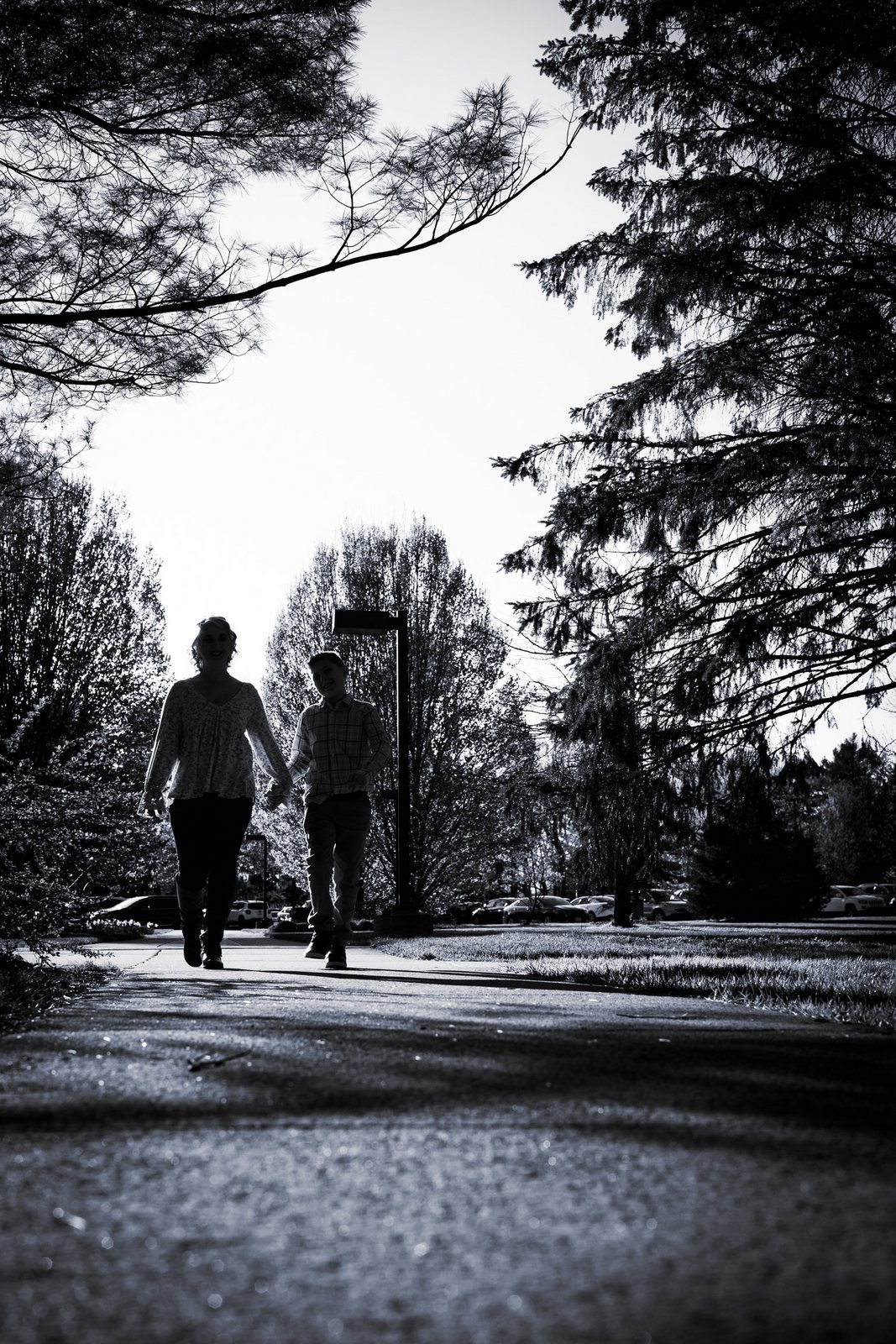 A couple walking away together, in black and white